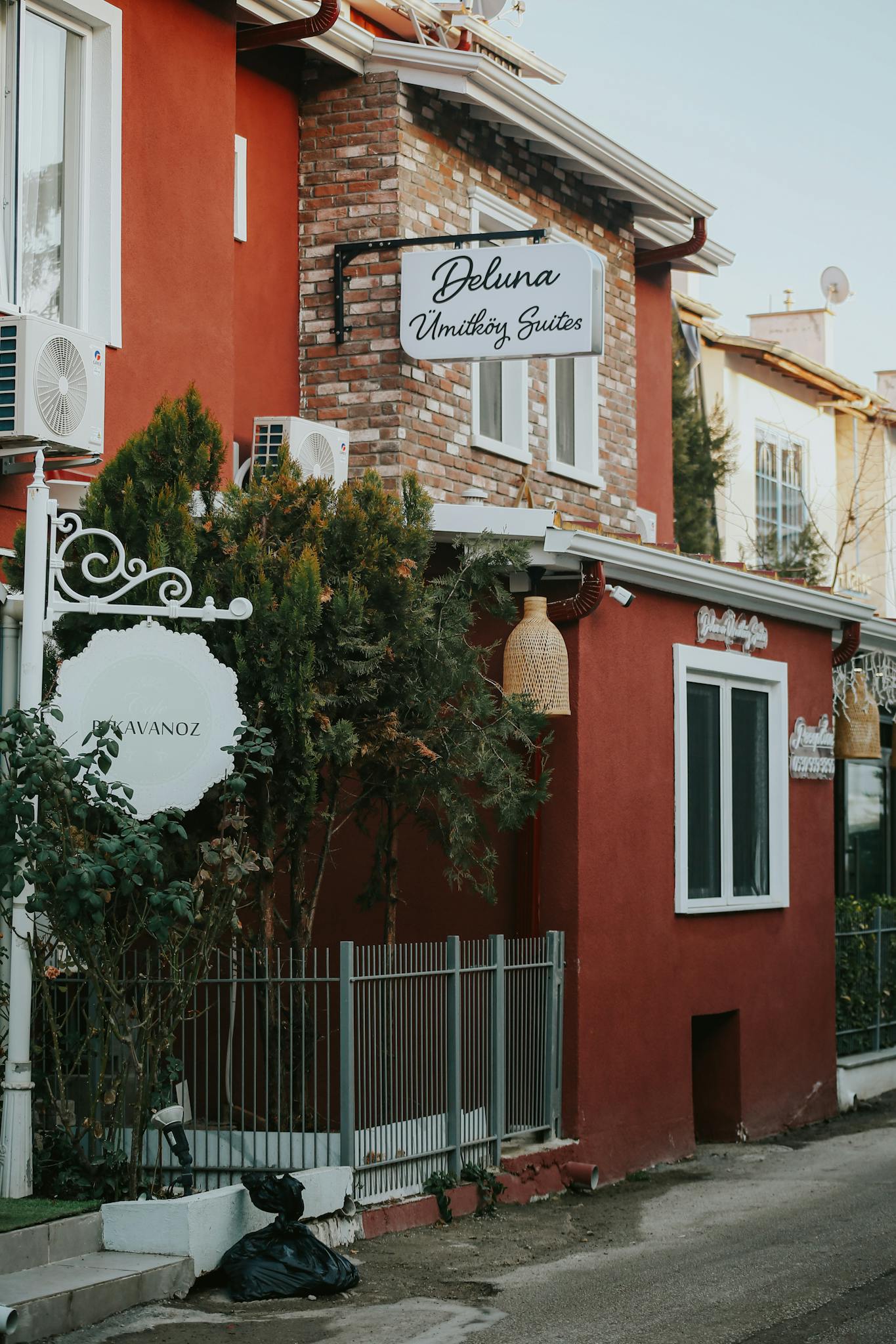 Charming exterior view of a rustic boutique hotel emphasizing unique architectural details.